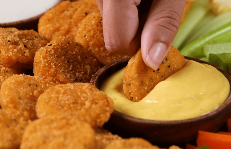 John Soules chicken nuggets dipped in honey mustard