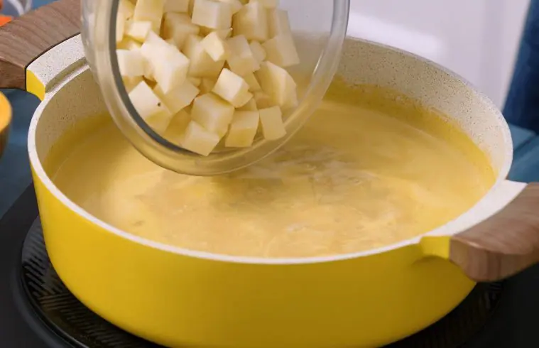 Simmering pot of Creamy Chicken Potato Chowder