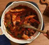 Image showing a pot of One Pot Chicken Cacciatore being stirred on a burner