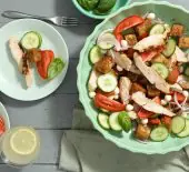 Flame Grilled Panzanella Salad in a bowl on a dinner table