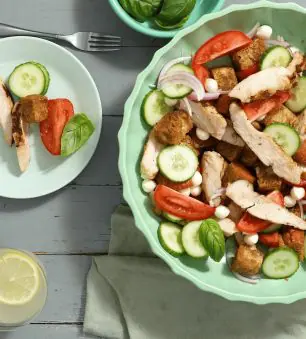 Flame Grilled Panzanella Salad in a bowl on a dinner table